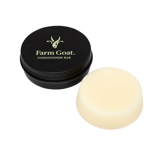 Farm Goat milk conditioner bar on white background next to travel tin