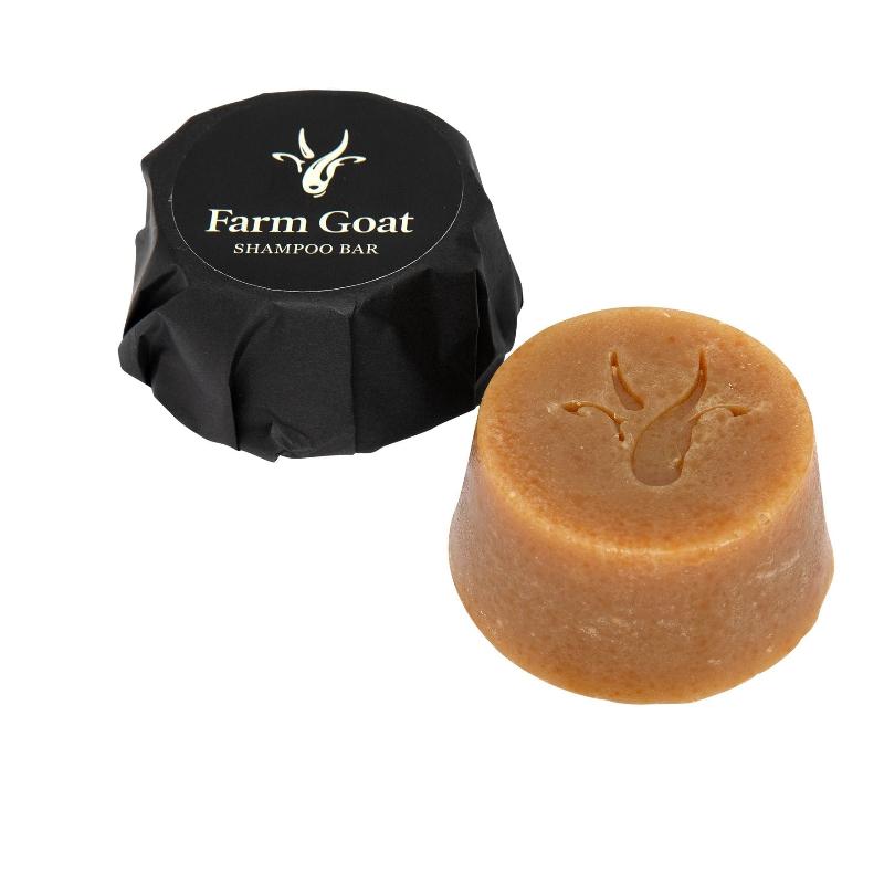 Farm Goat Milk Shampoo Bar on white background next to packaging