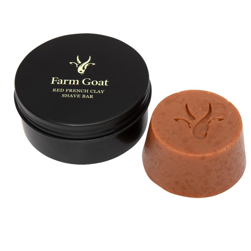 Farm goat french clay shave bar sitting next to travel tin