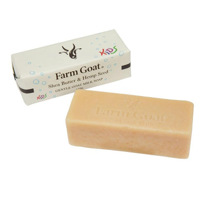 Farm Goat kids soap bar next to packaging listing ingredients 