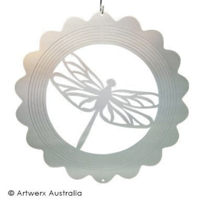 wind spinner laying flat with a white background. Wind spinner is of dragonfly in a circle.