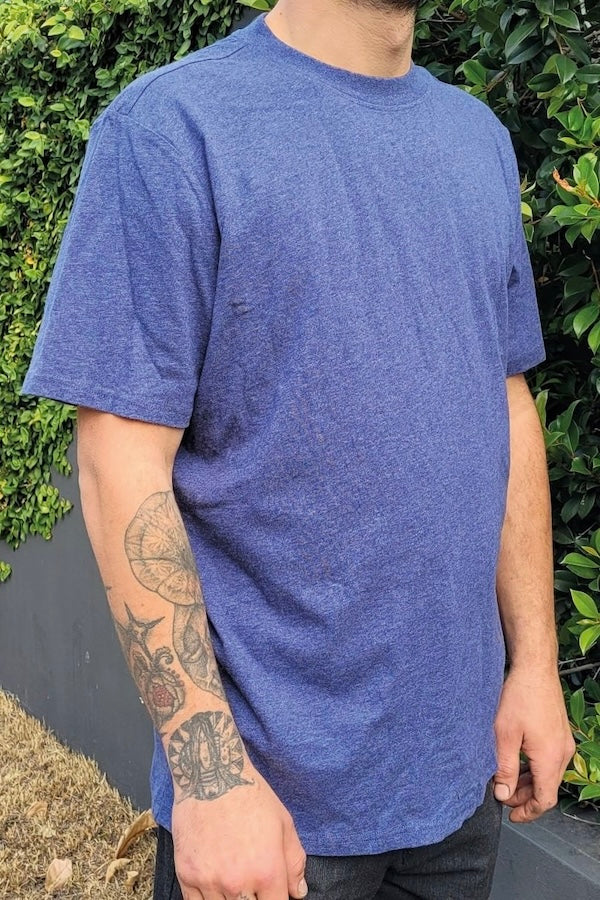 Blue combed cotton t-shirt on male model standing outside