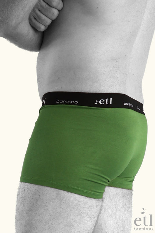 Mens underwear green boxers on male model side view