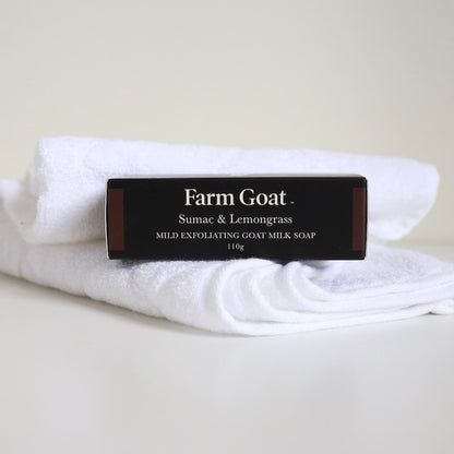 Farm Goat milk soap in packaging sitting on towel