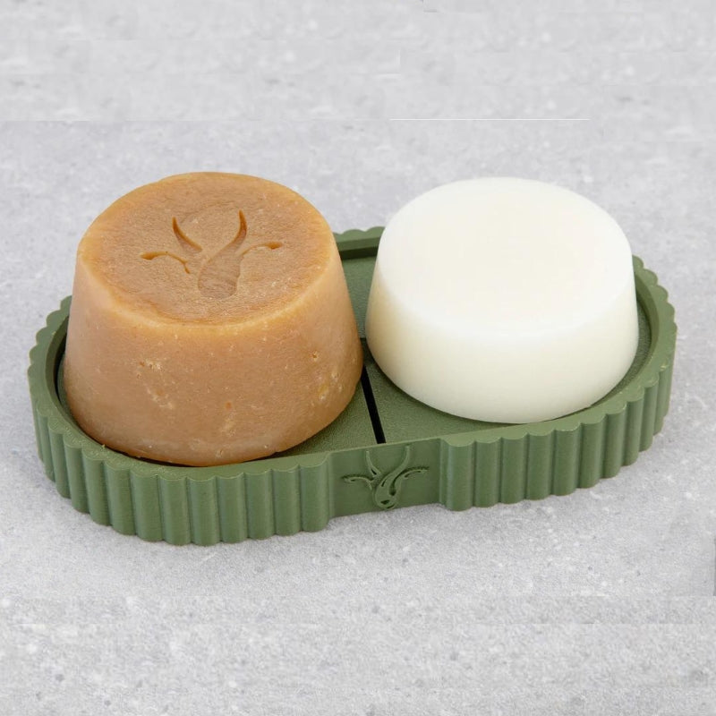 Green Farm Goat soap tray sitting on bench with 2 goats milk soaps on top