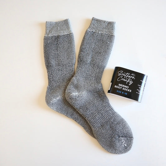 Merino boot socks laid out on table with label next to them