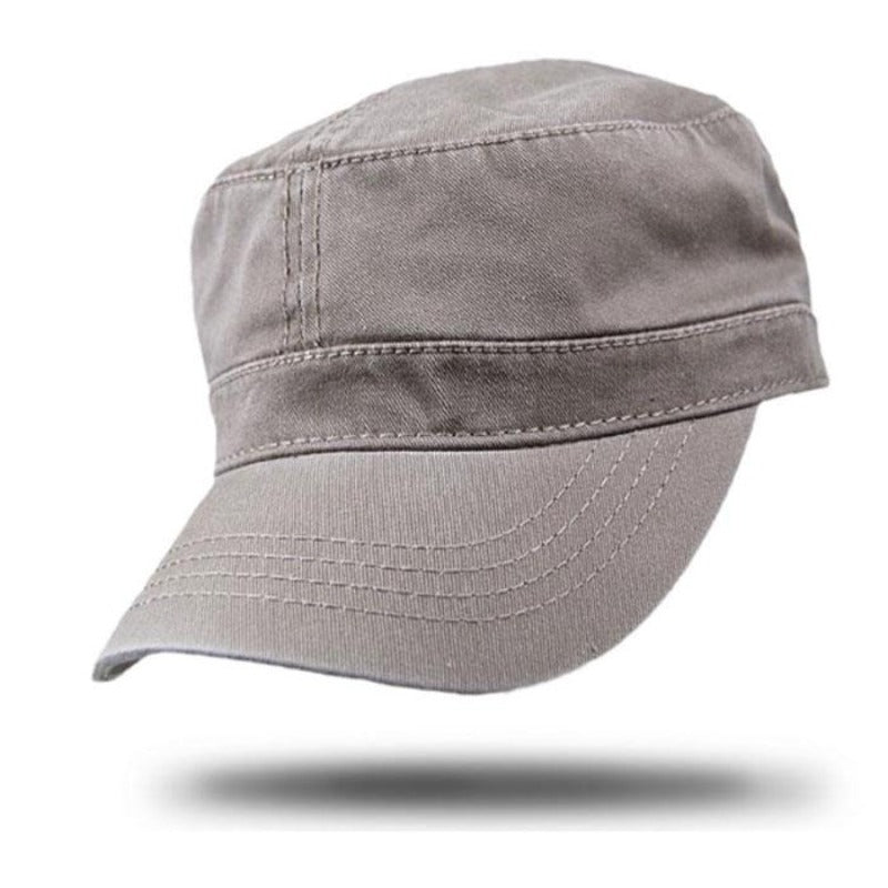 Beige cotton cap with velcro adjustment on white background