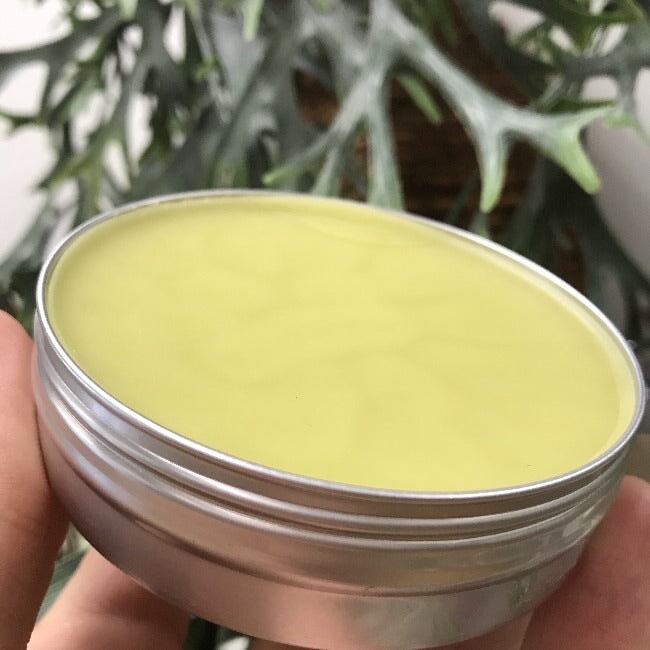 Inside tin of hemp healing balm showing contents