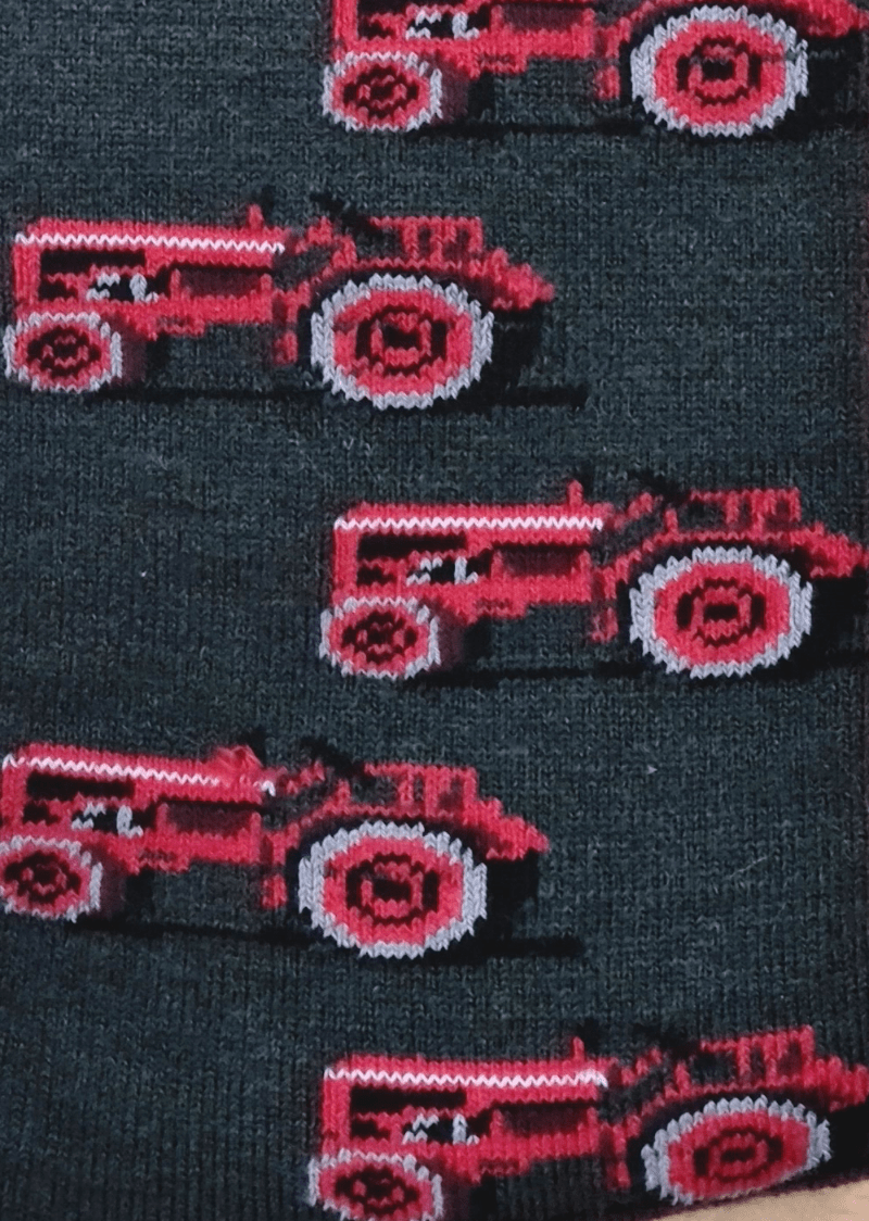 Close up Australian made merino wool grey socks with red tractor design