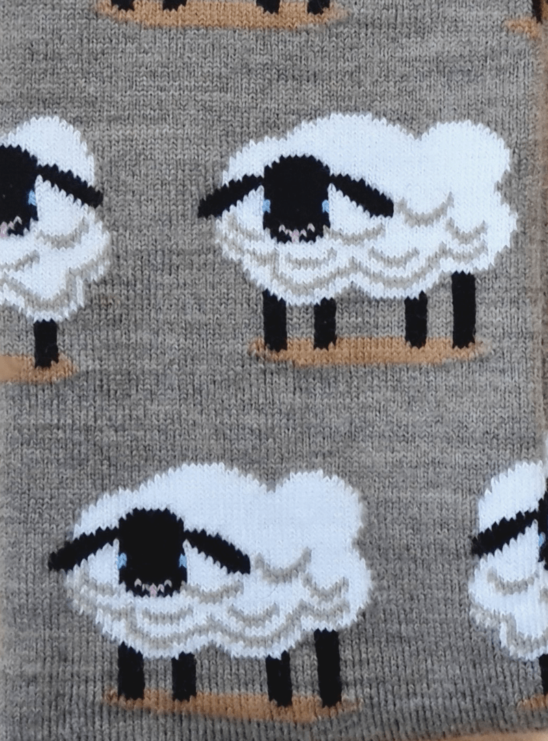 Close up Australian made merino wool grey socks with sheep design